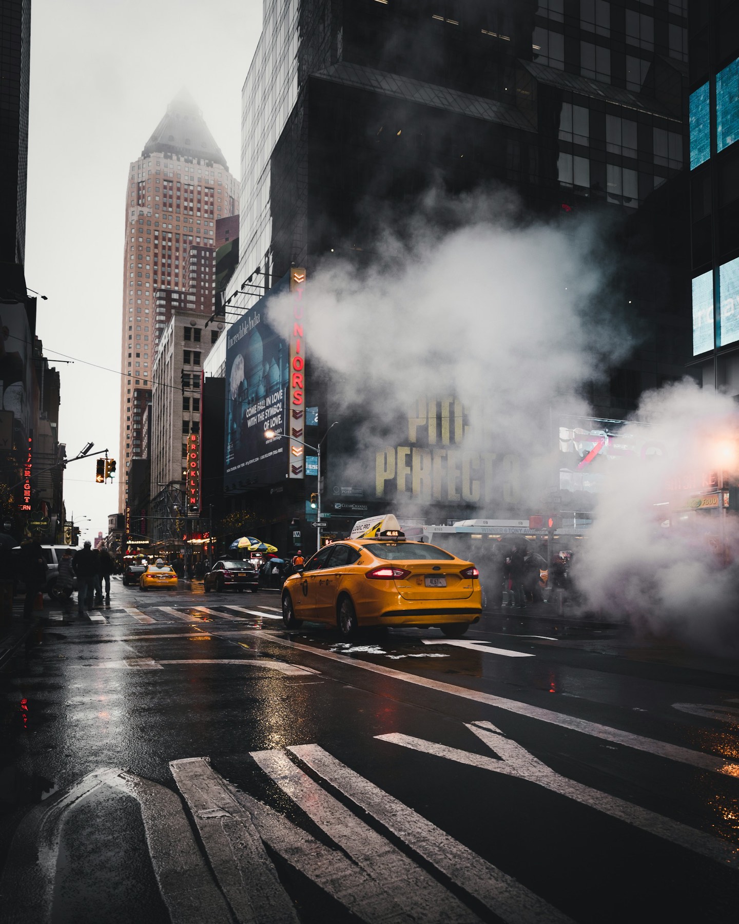 A New York City street at dawn with steam rising from the pavement